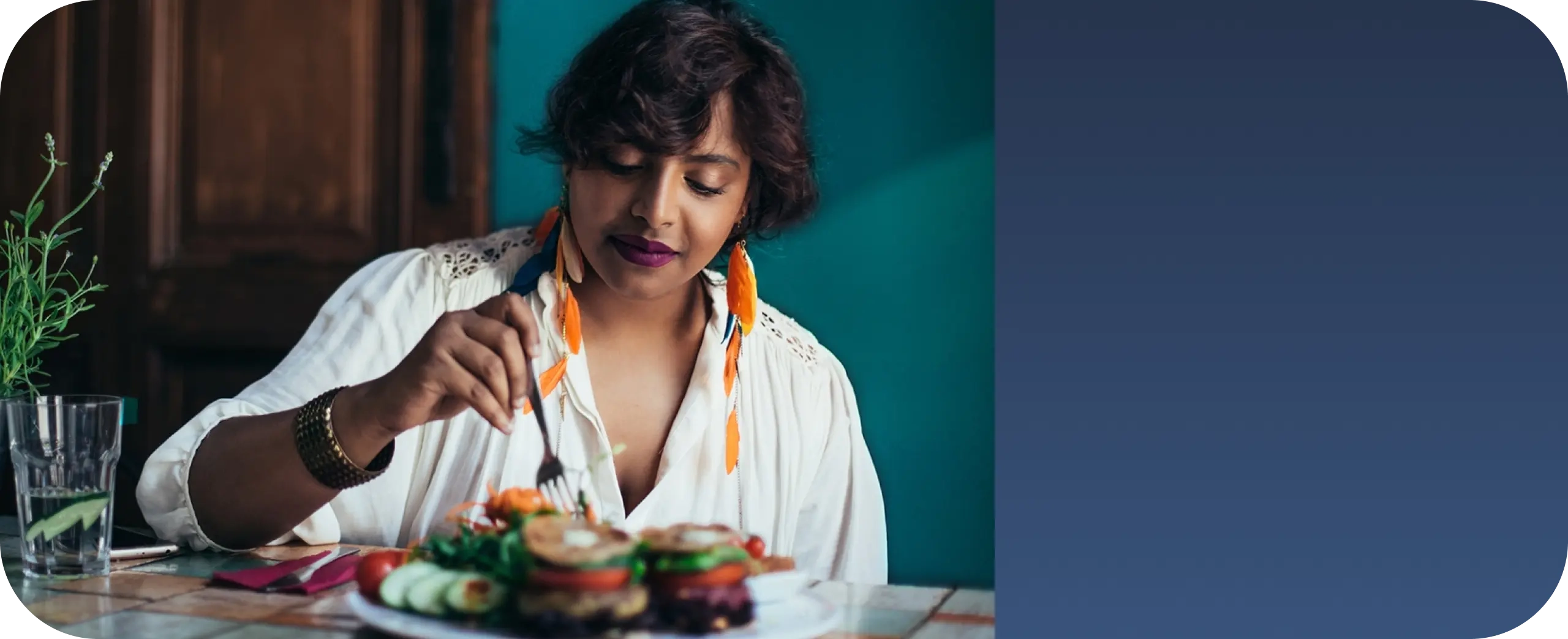 Woman eating in kitchen